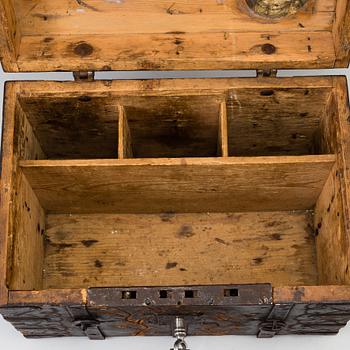 A wooden box, dated 1743.