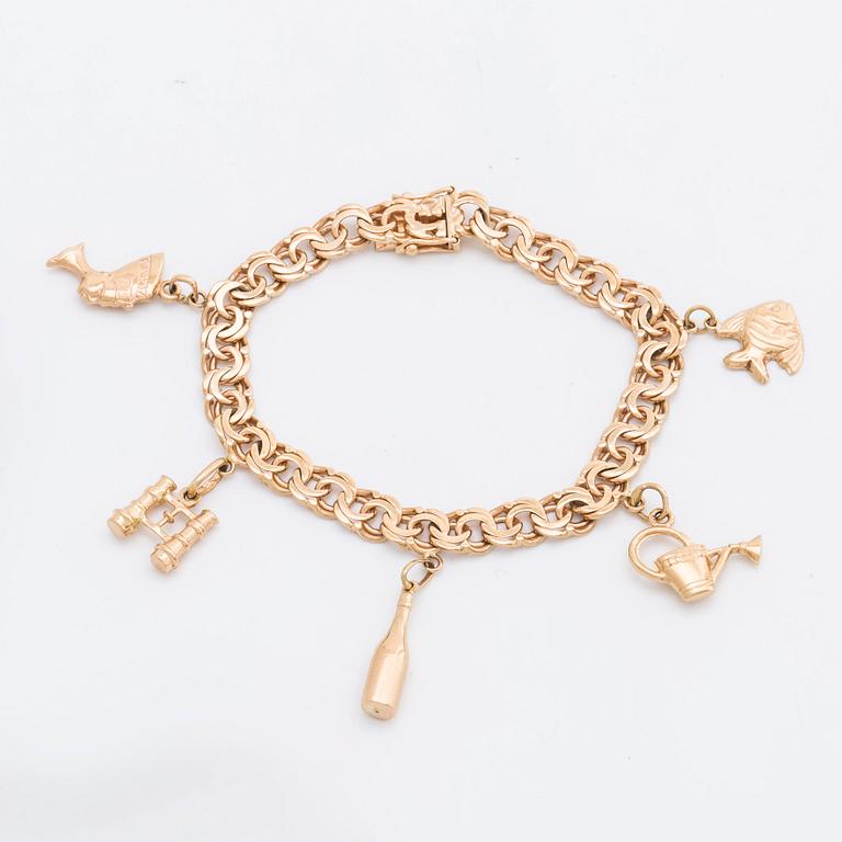 ARMBAND, 18K guld bismarcklänk med 5  berlocker, 21,7 g, Esto AB Guldvarufirman Stockholm 1963.