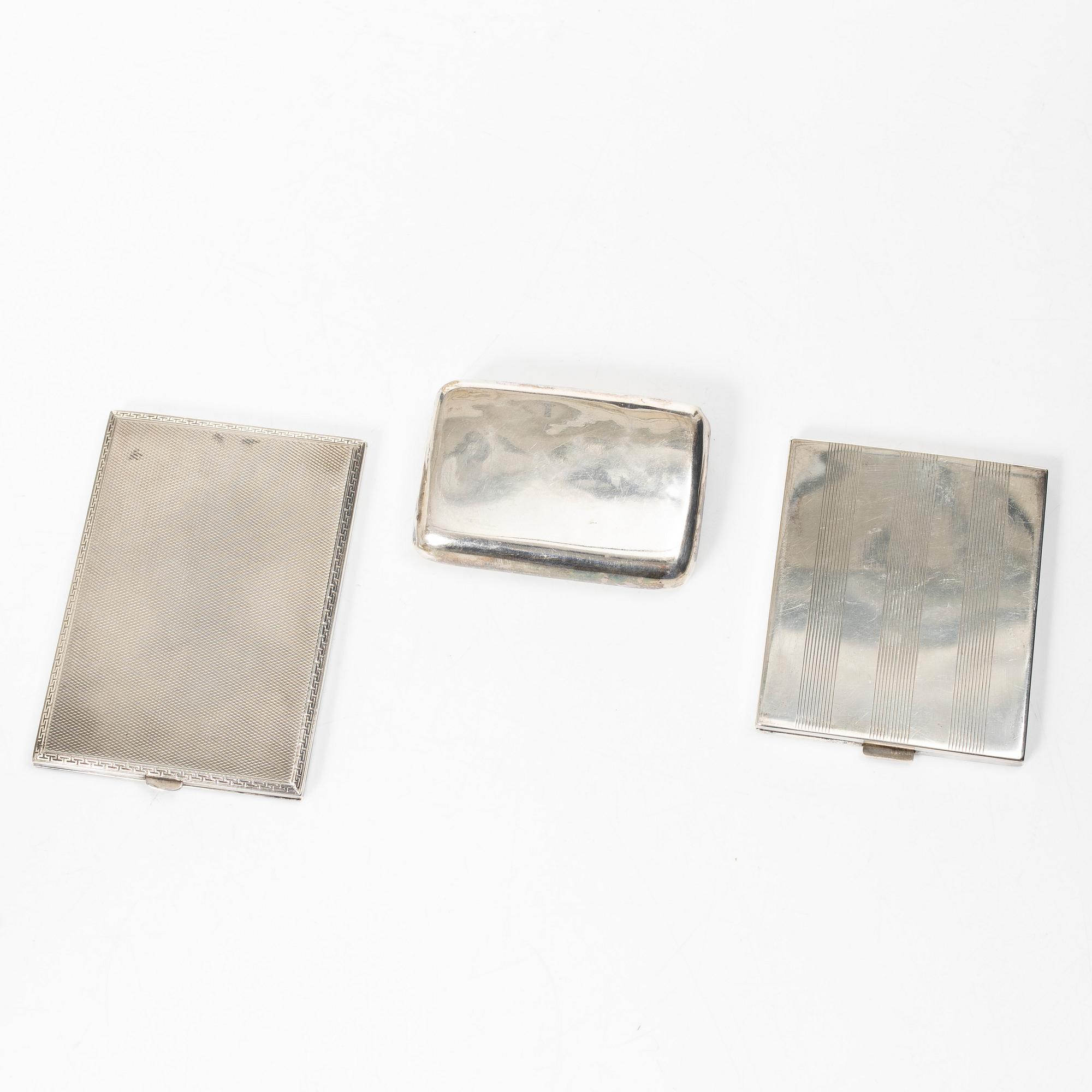 Two cigarette cases and a snuffbox, silver, Sweden and Swedish import marks respectively.
