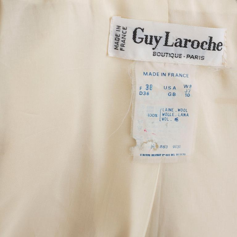 A trench-coat by Guy Laroche.