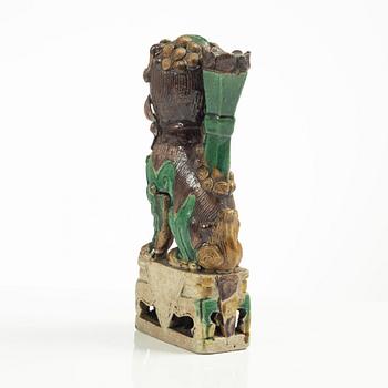 A Sancai glazed Buddhist lion incense/joss stick holder, Qing dynasty, Kangxi (1662-1722).
