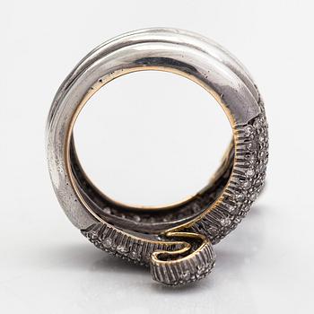 A serpent ring in gold and silver with rubies and single cut diamonds ca 0.88 ct in total.