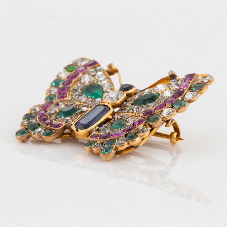 A butterfly brooch/pendant in 14K gold set with old-cut diamonds.