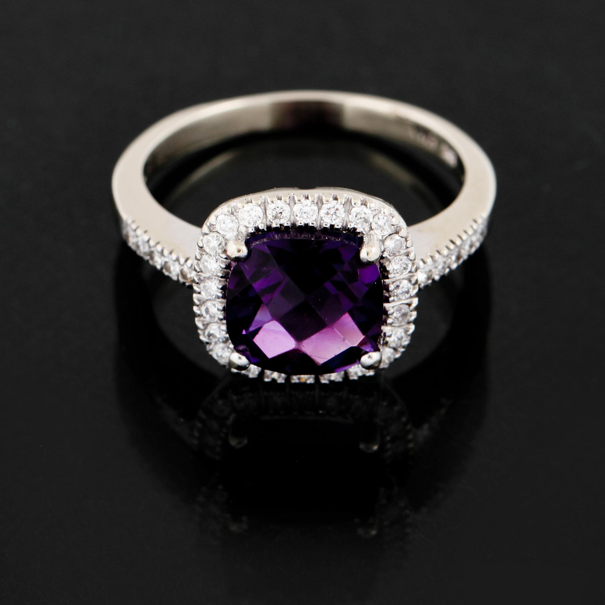 RING, 14K vitguld med checkerslipad ametist samt små briljantslipade diamanter. Vikt 3,6 g.