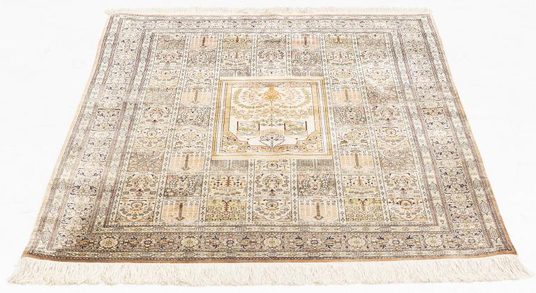 A carpet, oriental silk, circa 145 x 97 cm.