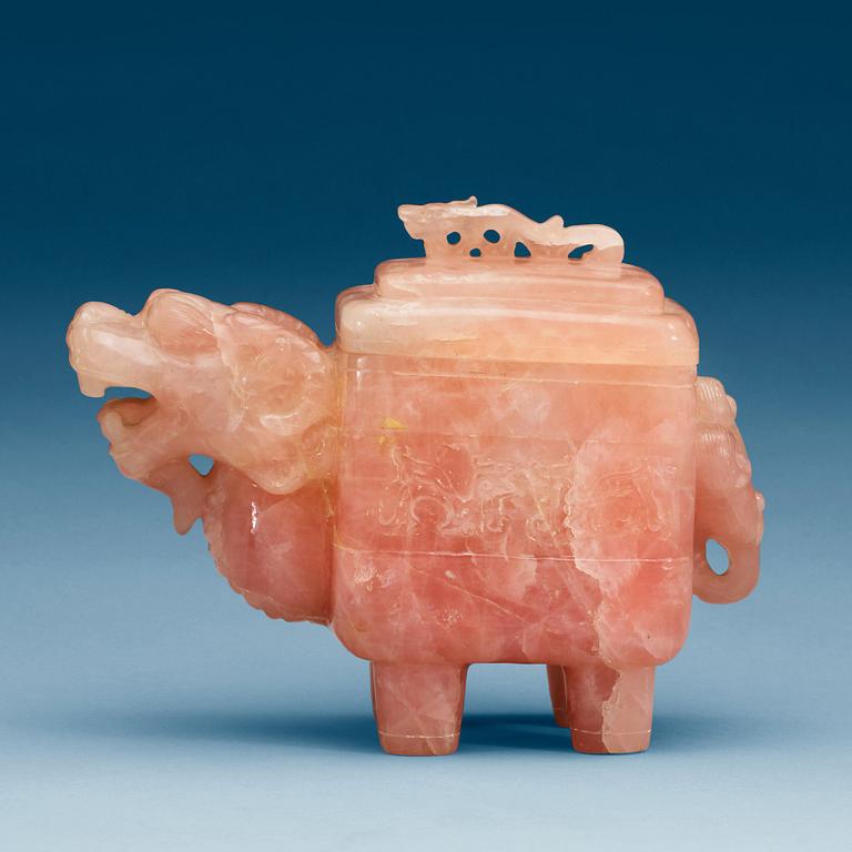 A dragon-shaped rose quartz box with cover, China.