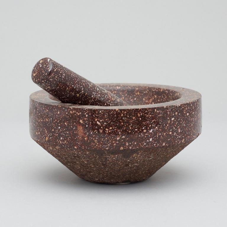 A Swedish porphyry mortar with pestel.