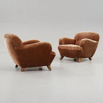 A pair of Mid century Modern easy chairs, probably 1939.