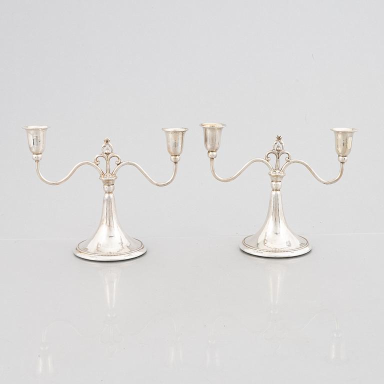 A Pair of Swedish Grace Silver Candelabras, mark of K Anderson, Stockholm 1930.