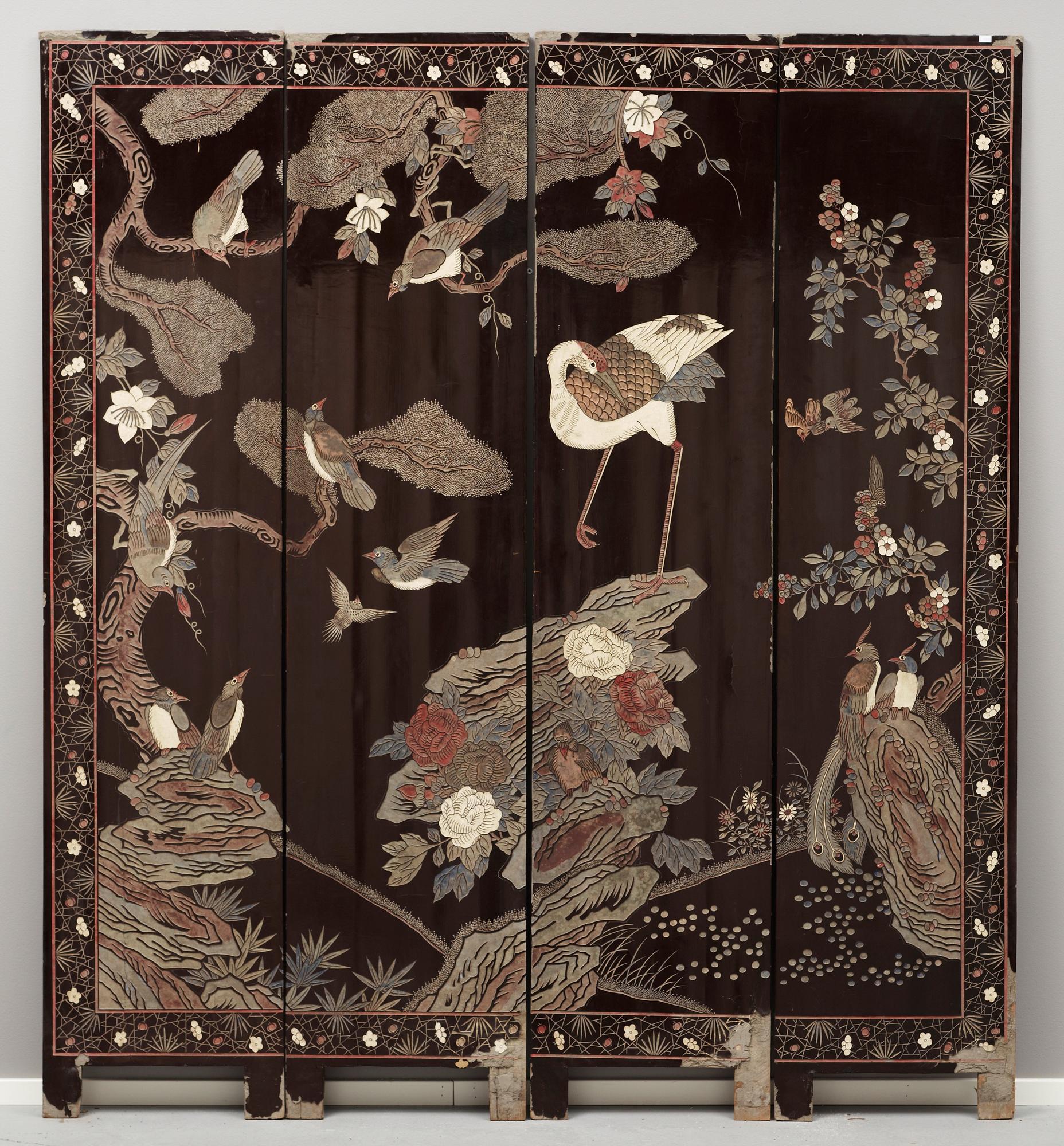 A coromandel black-lacquer four panel screen, Qing Dynasty (1644-1912).