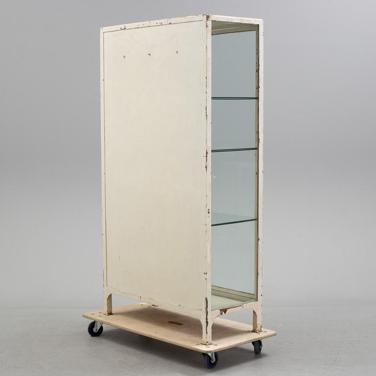A mid 20th century metal display cabinet.
