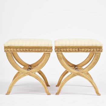 A pair of late Gustavian giltwood stools, Stockholm, late 18th century.