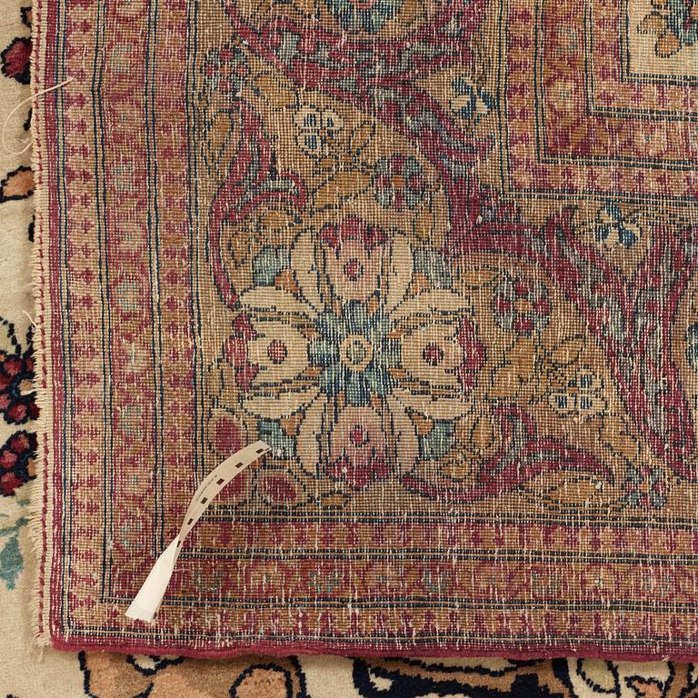 A CARPET, a semi-antique Esfahan figural, 215,5 x 140,5 cm.