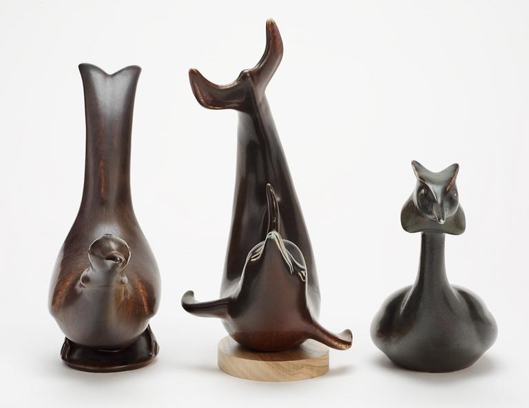 Three Gunnar Nylund stoneware figures, a dolphin, a pheasant and a great crested grebe, Rörstrand.