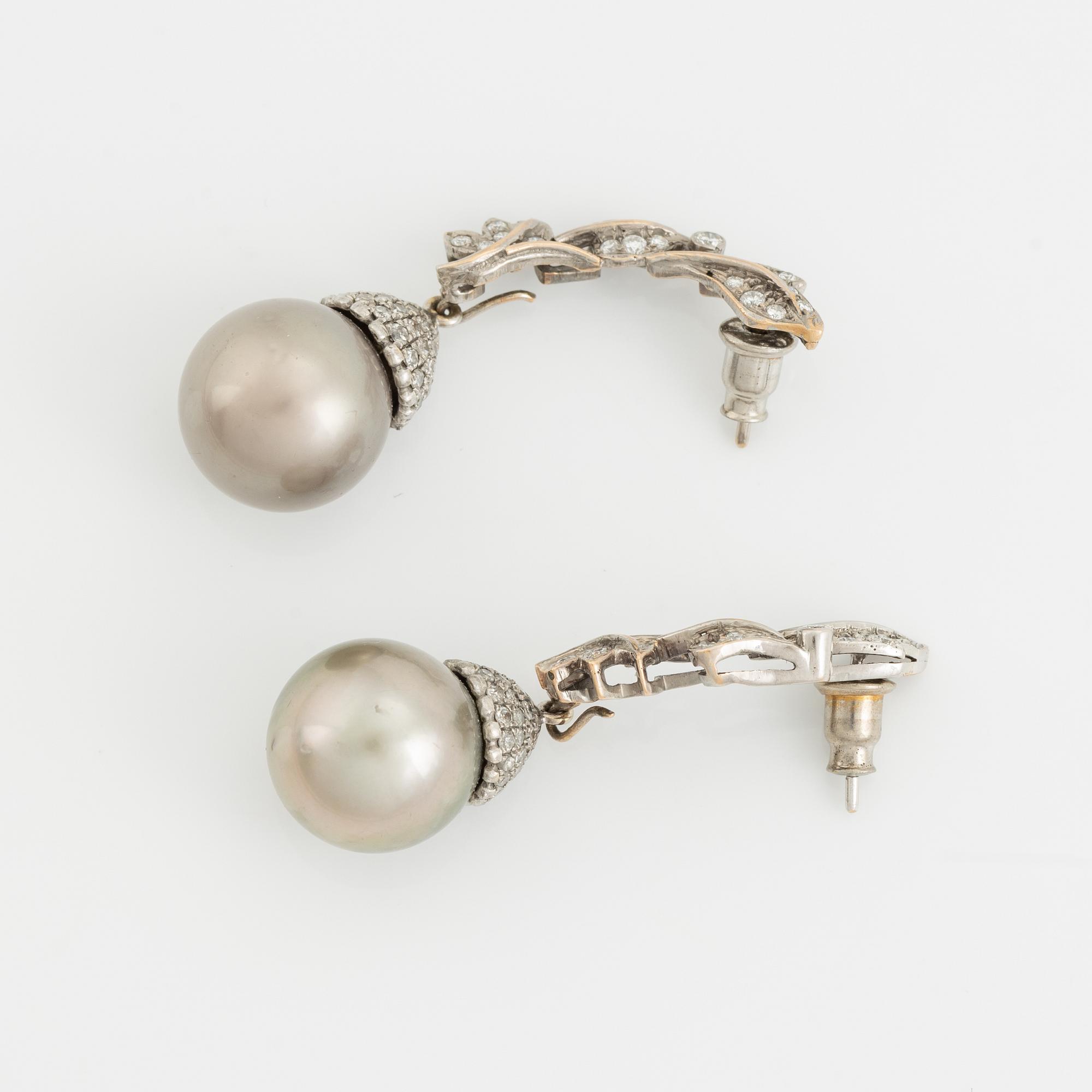 White gold, Tahiti pearl and brilliant cut diamond earrings.