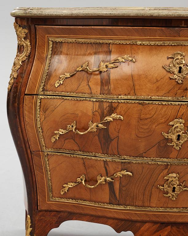 A rococo ormolu-mounted and parquetry commode attributed to C. G. Willkom (master in Stockholm 1763-65).