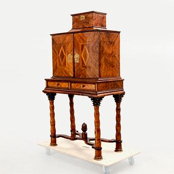 A first half of the 18th century walnut cabinet.