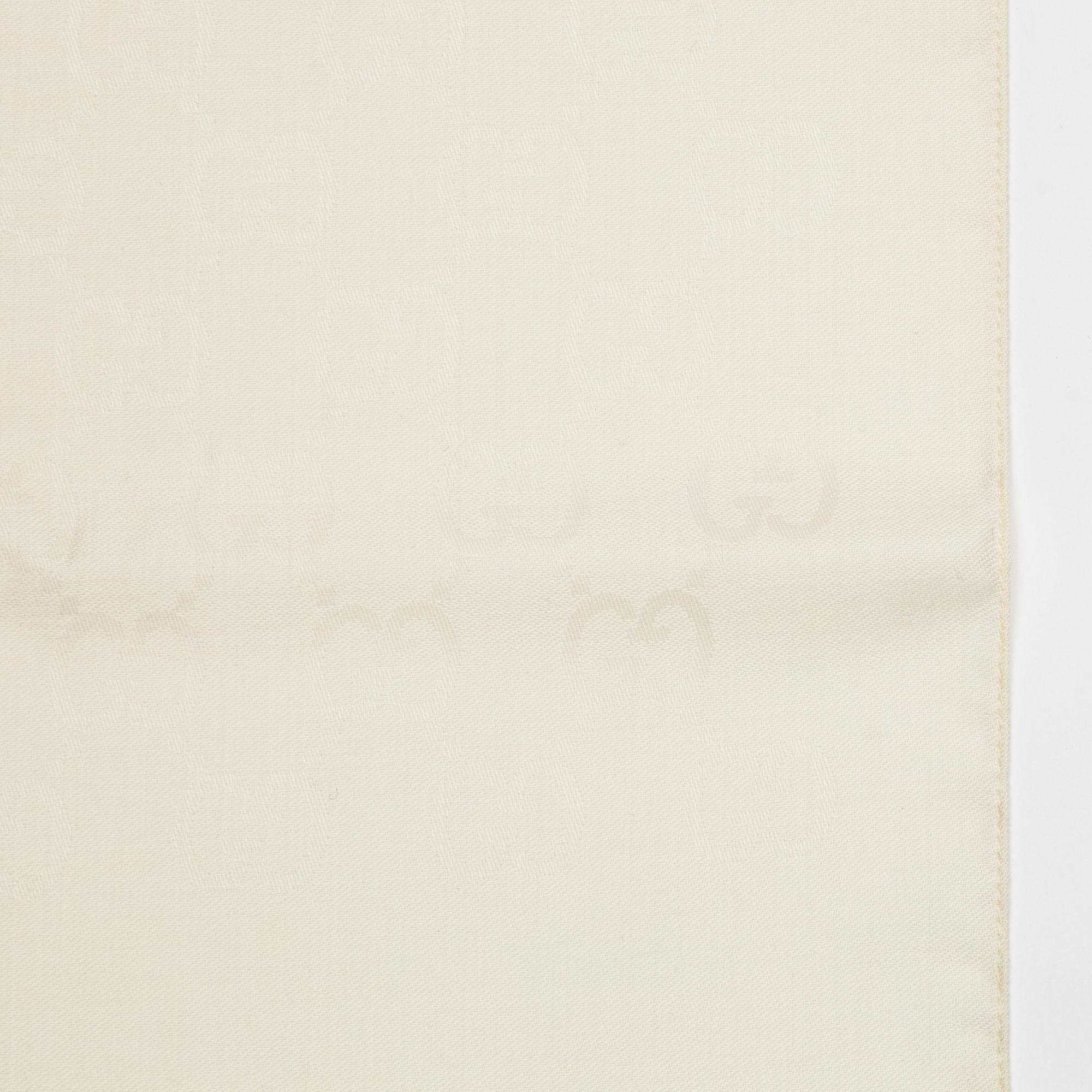 Gucci, a wool and silk mix "GG" jaquard shawl.