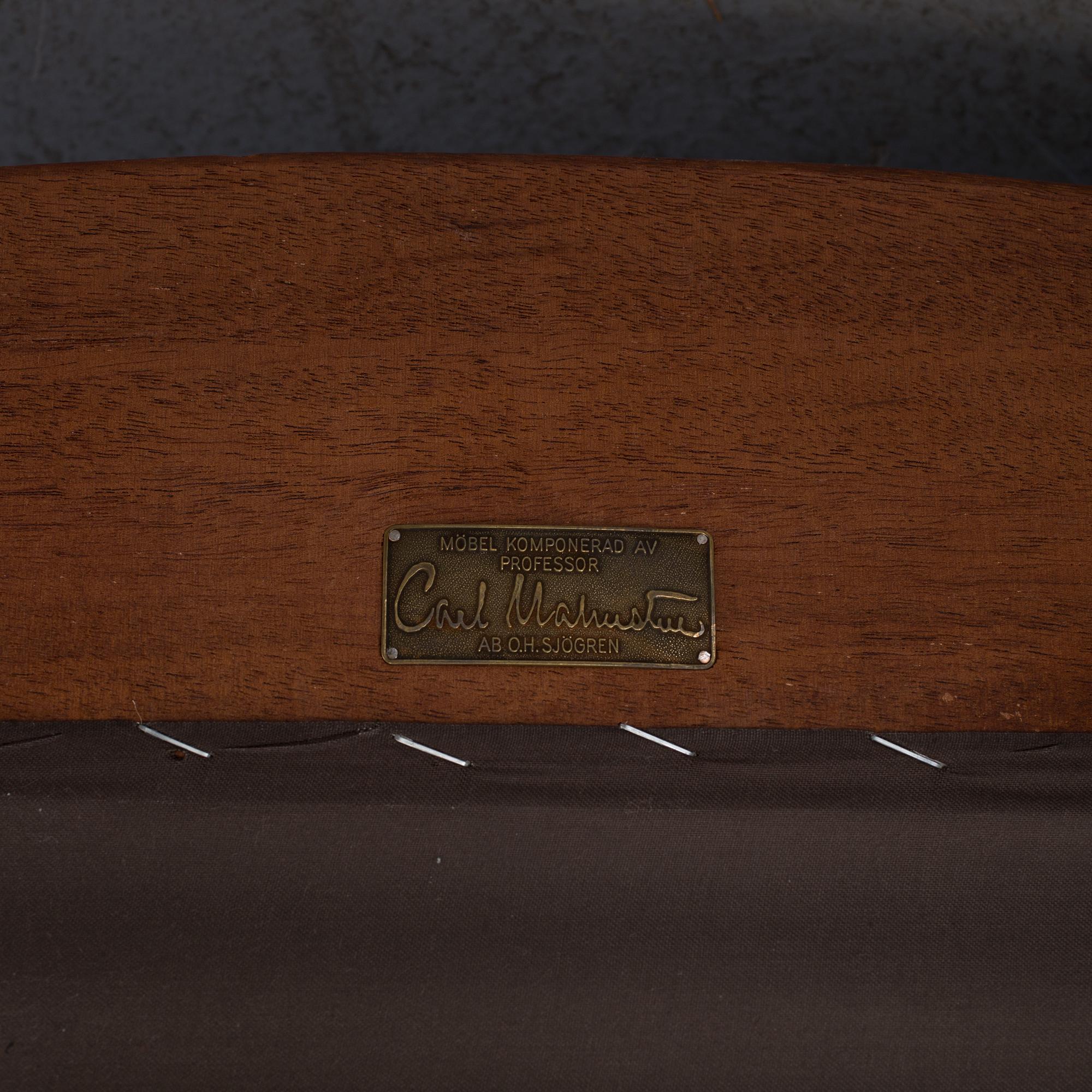 An "Vår Fru" armchair by Carl Malmsten.