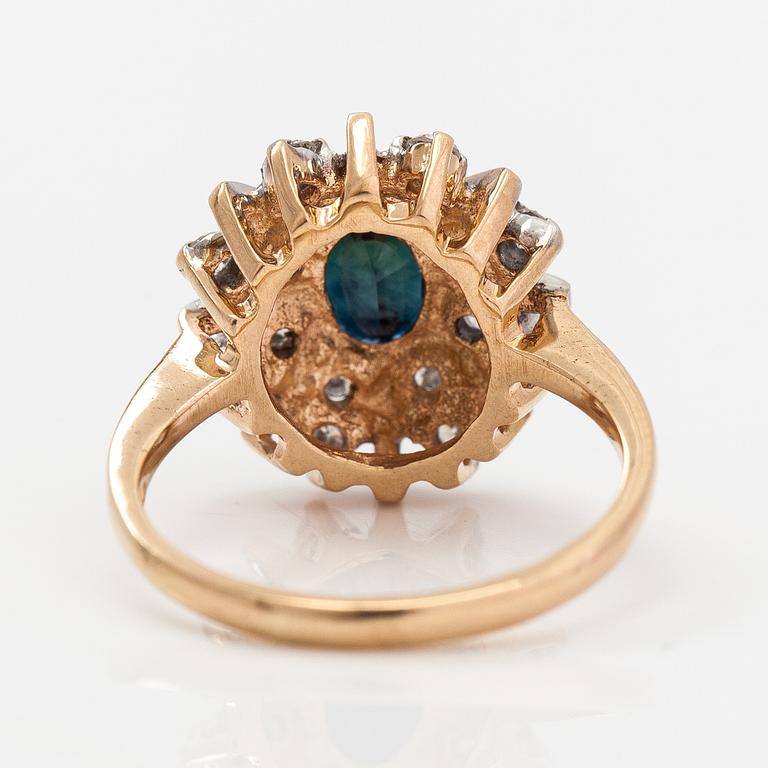 A 14K gold ring with diamonds ca. 0.40 ct in total and a sapphire. Finland 1995.
