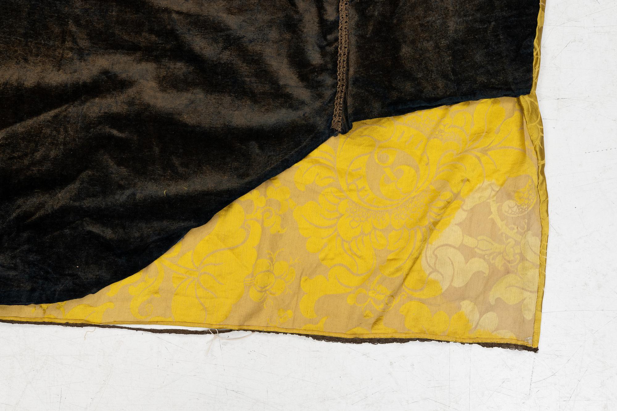 An embrodiered textile with a five clawed dragon, lined with yellow silk, Qing dynasty.