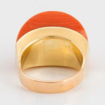 An 18K gold and coral ring set with eight-cut diamonds.