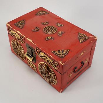 A red and gilt lacquered 'marriage' chest, late Qing dynasty.