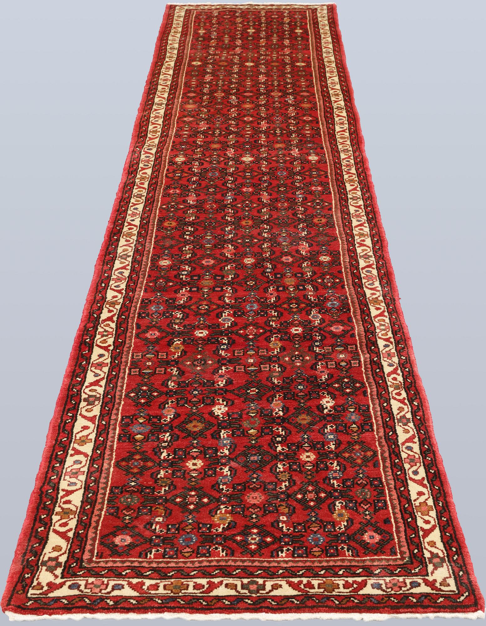 A Hosseinabad runner, c. 386 x 81 cm.