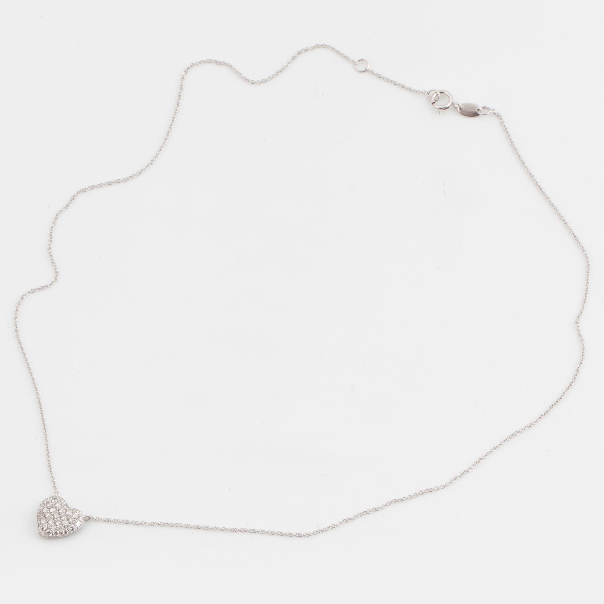 A heart shaped brilliant-cut diamond necklace.