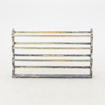 A painted early 1900s shelf.