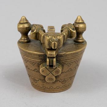 A brass weight set, late 19th century.