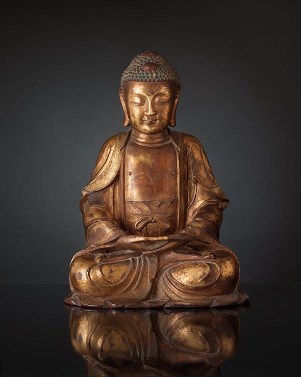 A large gilt bronze figure of Buddha, Ming dynasty (1368-1644).