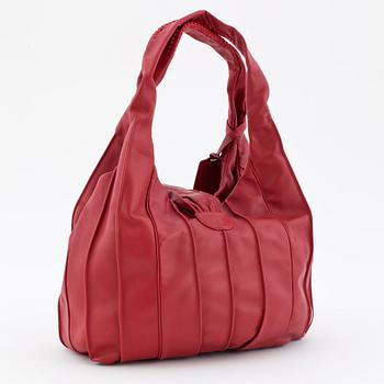LANCEL, a red leather shoulder bag.