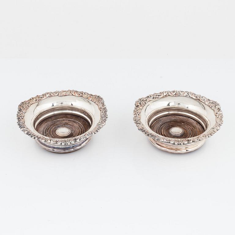 A pair of silver plated coasters, circa 1900.