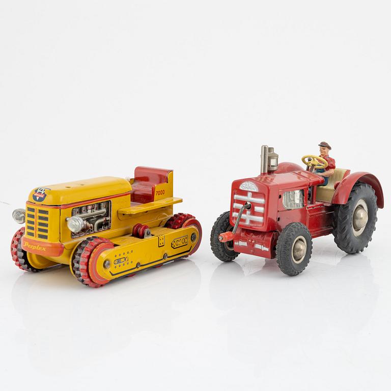 Five tin toys, including Arnold and Gama, 20th Century.