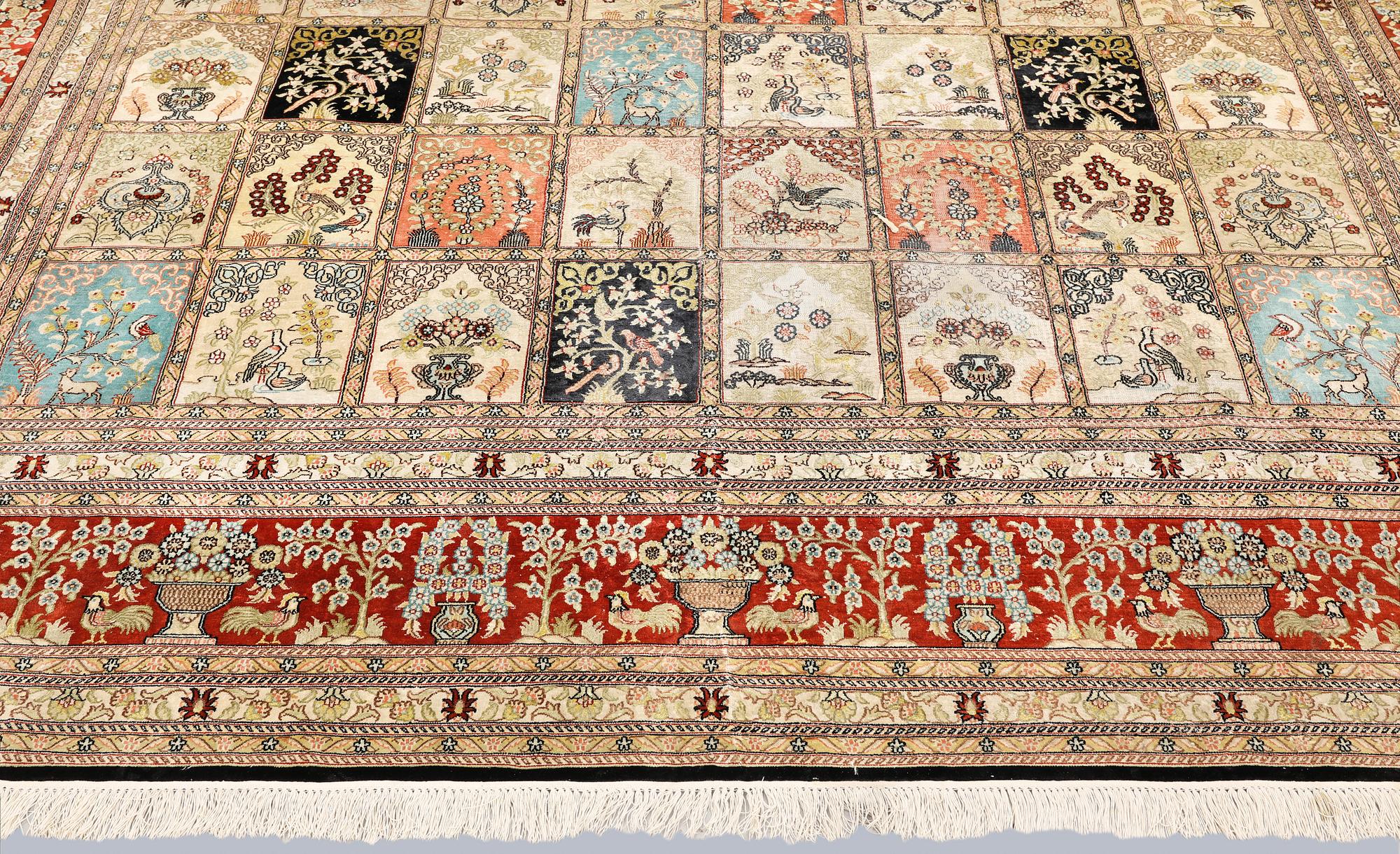 An oriental silk carpet, approx. 376 x 274 cm.