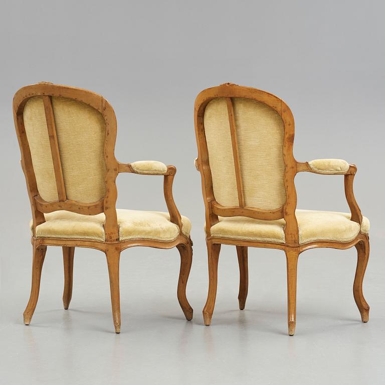 Two matched Louis XV 18th century armchairs.