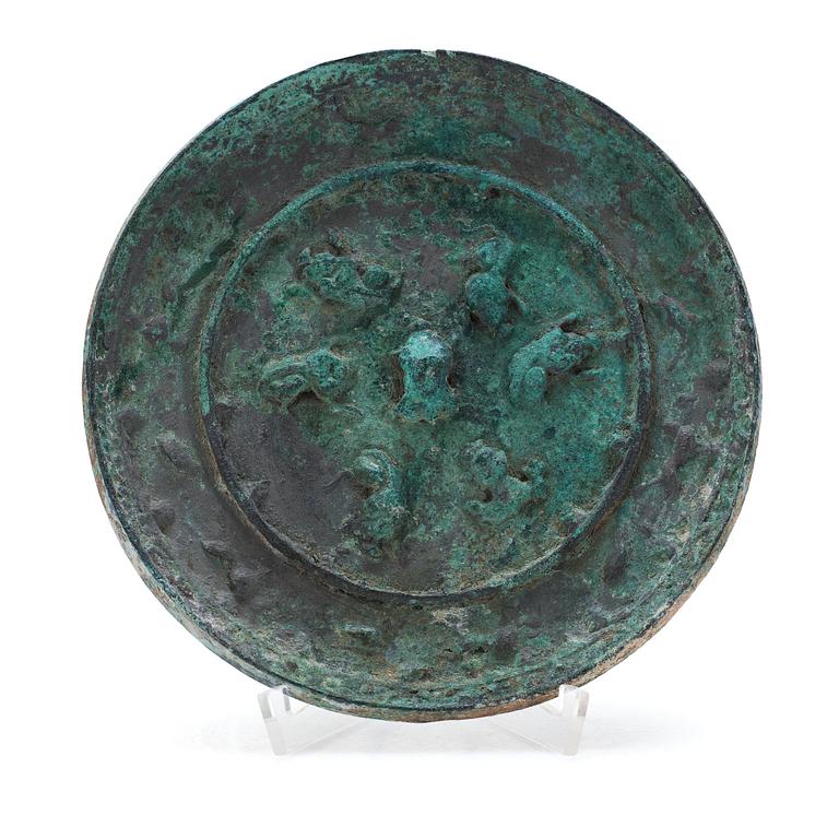 A broze mirror, presumably Tang dynasty (618-907 A.D.).