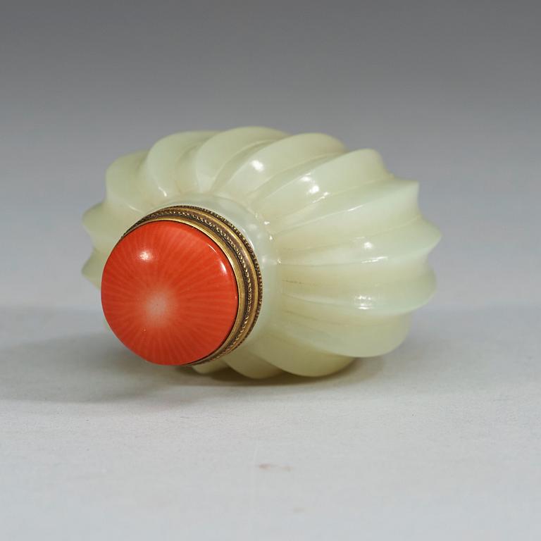 A finely carved nephrite snuff bottle with stopper, China.