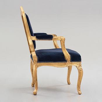 A Rococo mid 18th century armchair.