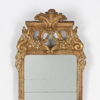 A Gustavian carved giltwood mirror, Stockholm, late 18th century.