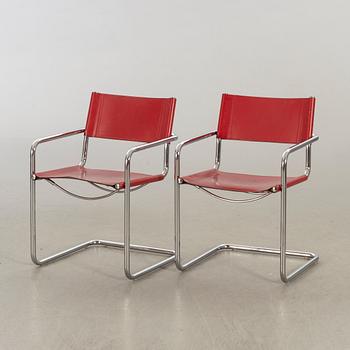 A pair of 20th century later part  armchairs.