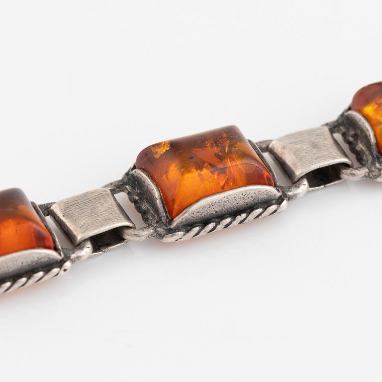 Silver and amber bracelet and earrings.