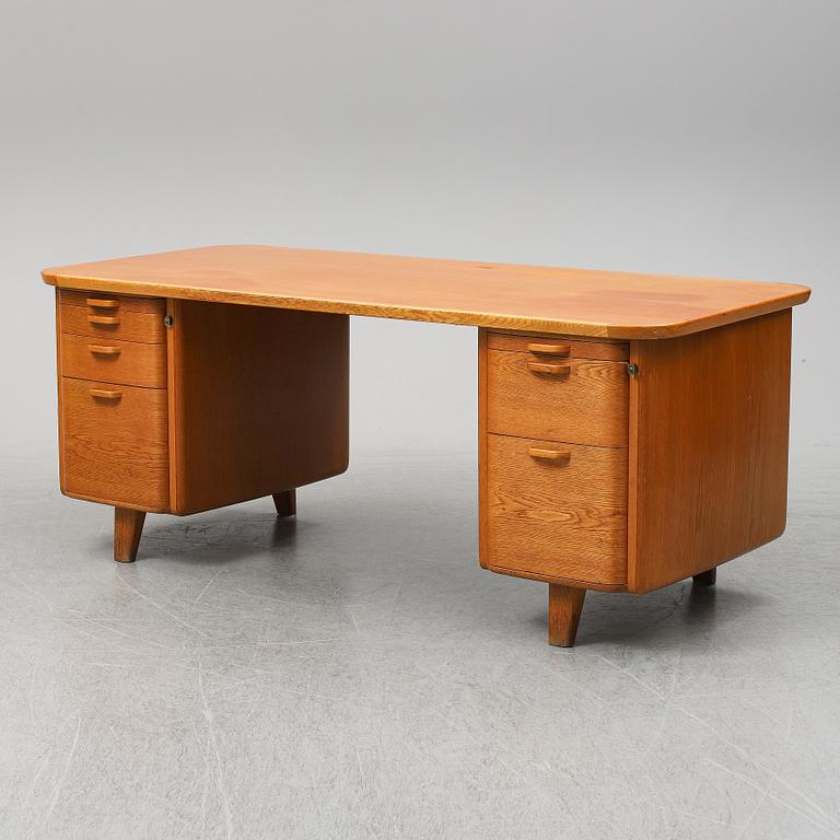 A 1950/60's oak writing desk.