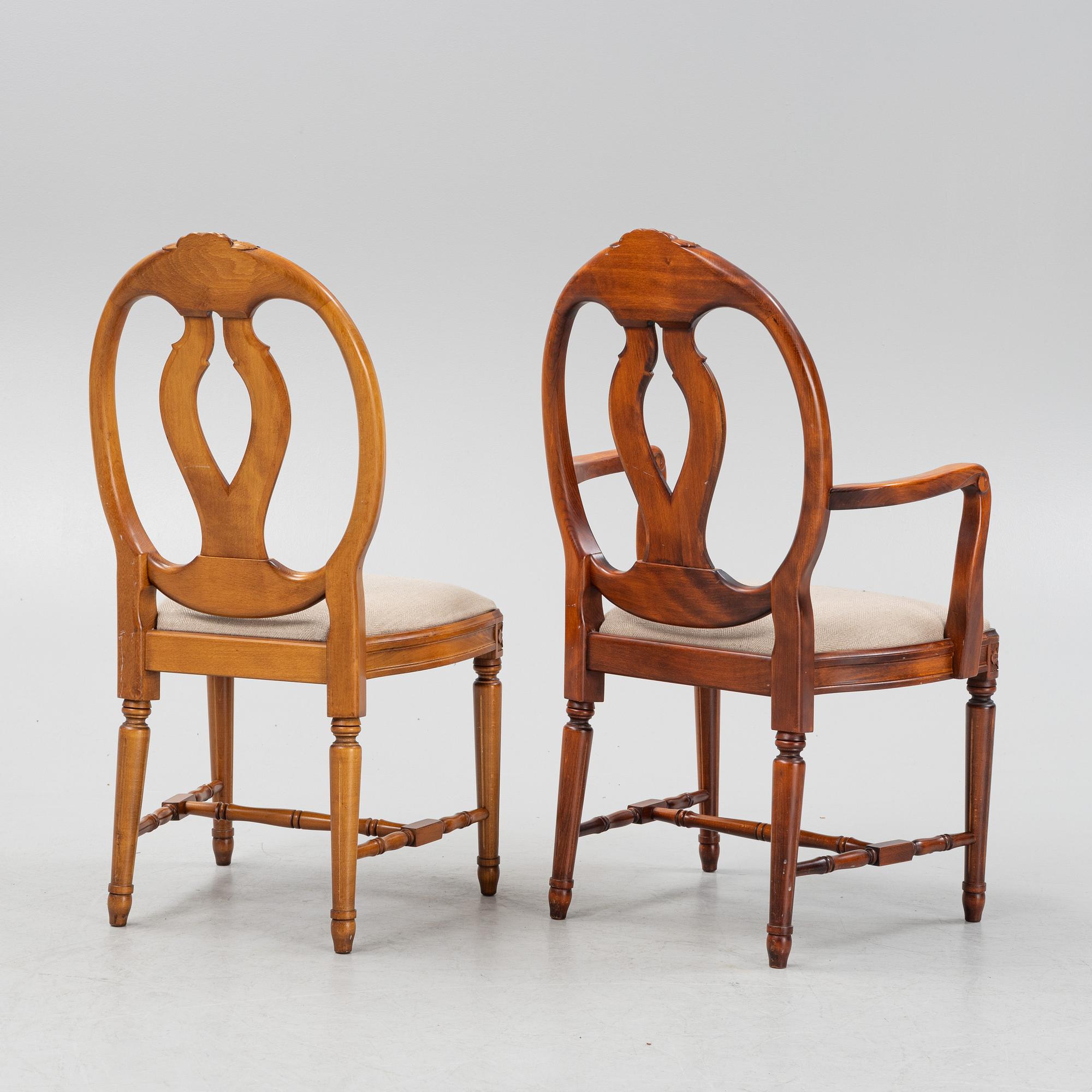 A Gustavian style dining table with two armchairs and four chairs, late 20th century.