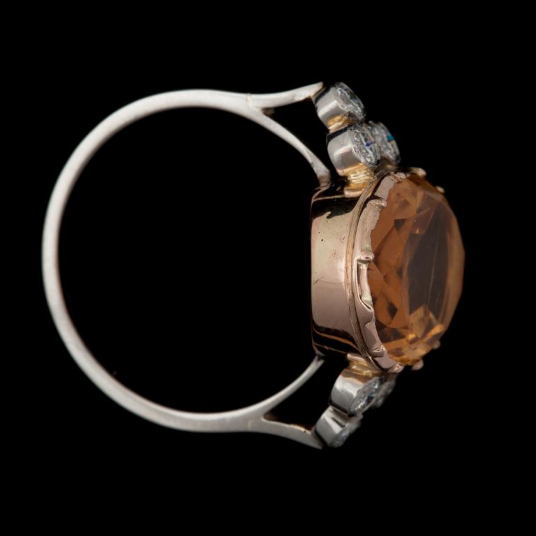 A 6.48 cts topaz and diamond ring. Total carat weight of diamonds 0.32 ct.