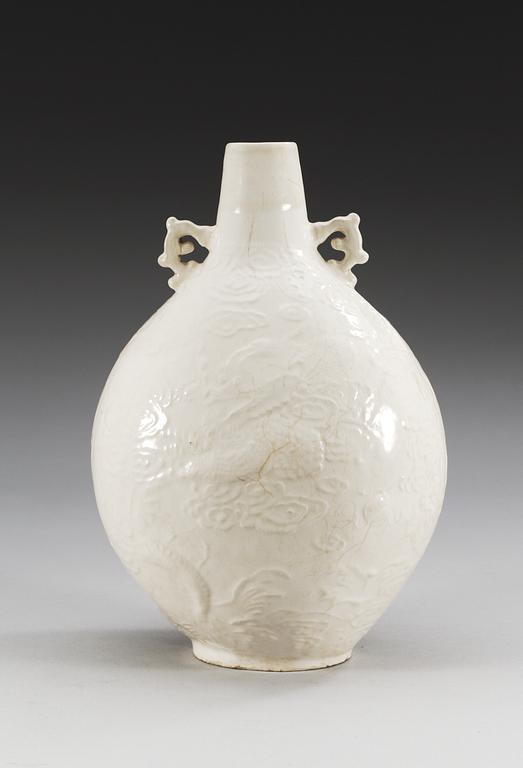A Ding type soft paste pilgrim bottle vase, Ming dynasty (1368-1644).