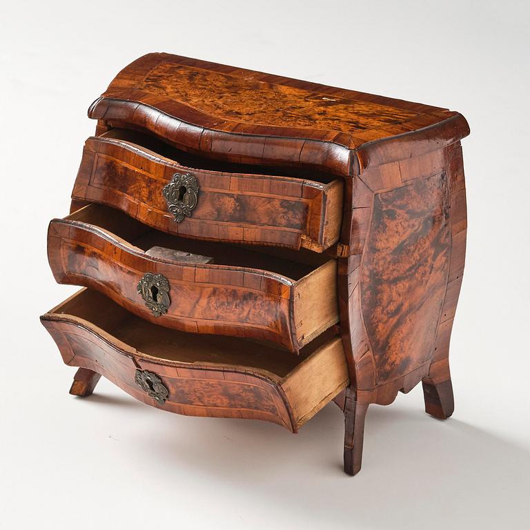 A Swedish rococo walnut parquetry miniature commode, later part 18th century.