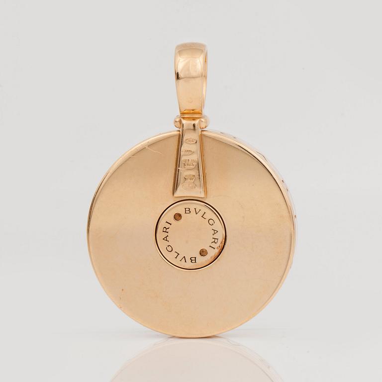 A Bulgari gold and mother of pearl spinning pendant.