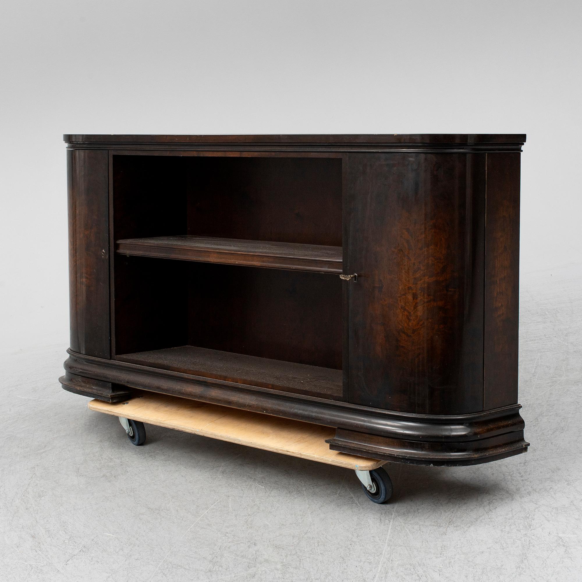 A 1930s stained birch shelf.